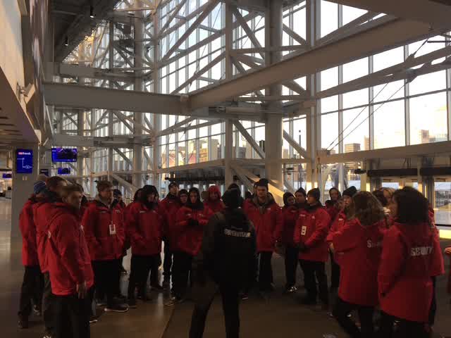An event operations team gathers for a briefing.