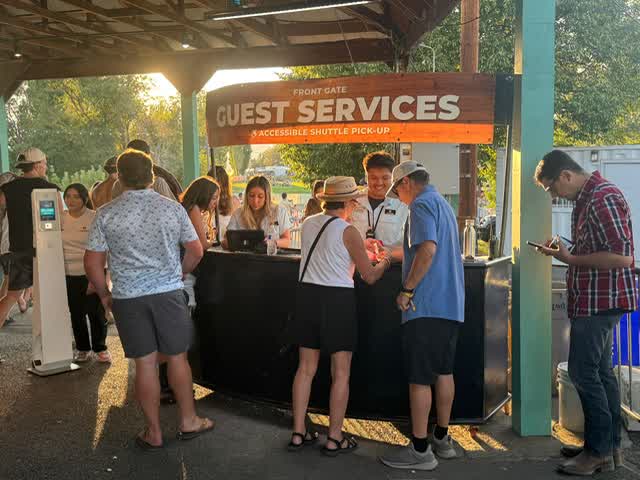 A guest-services team supports attendees at an event.